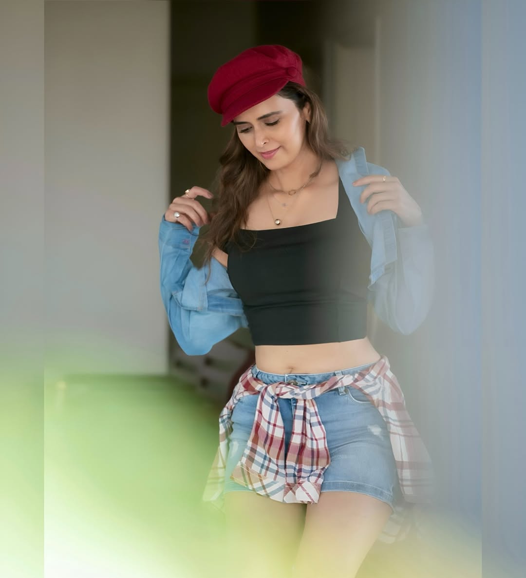 Meenakshi Dixit effortlessly combines casual cool with a touch of playful sass–proof that a great hat and a confident smile are the ultimate style upgrades!