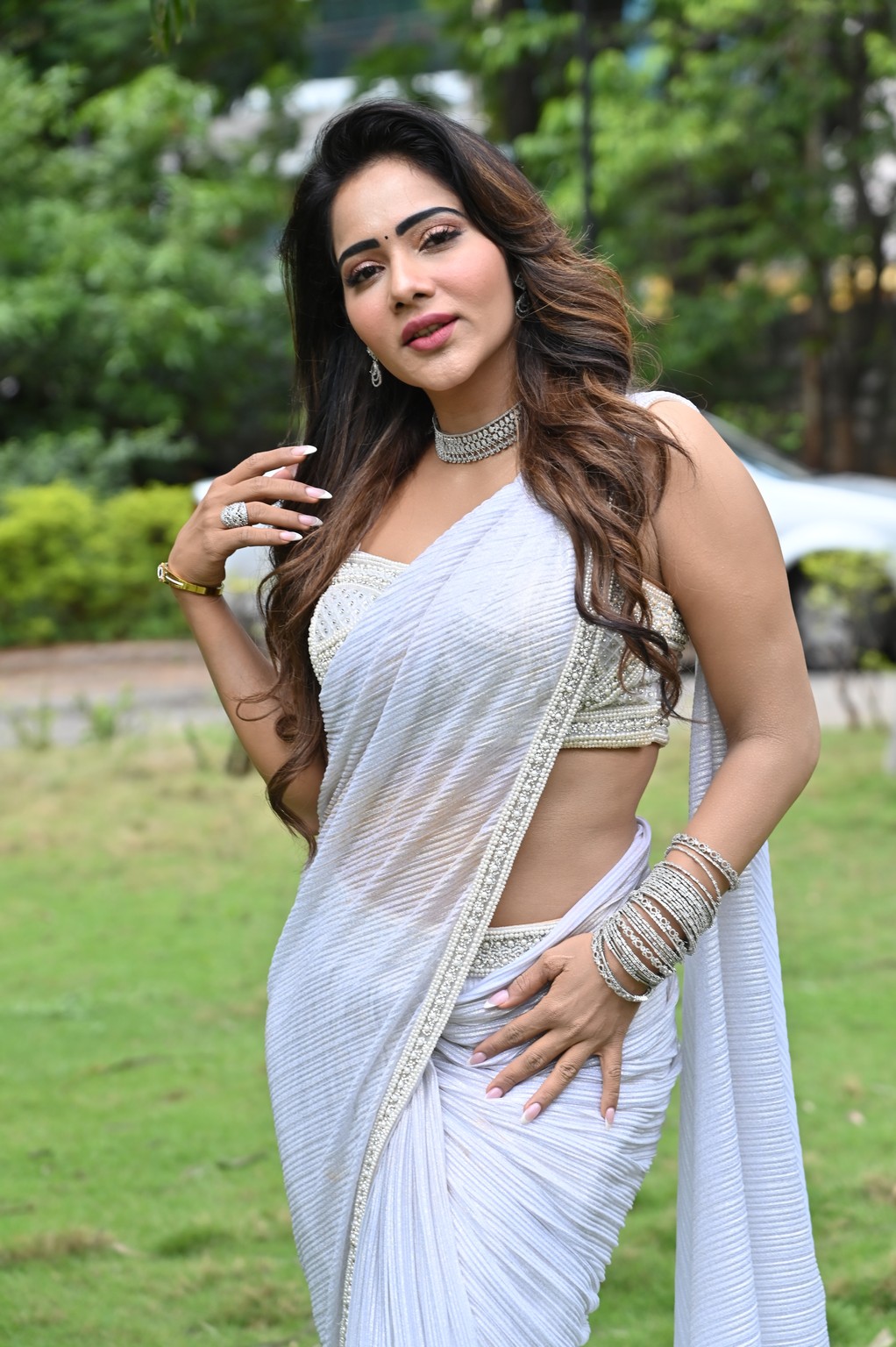 Mitraaw Sharma in a breathtaking white saree, serving looks so fierce the sunshine itself seems to be chasing her for fashion tips!
