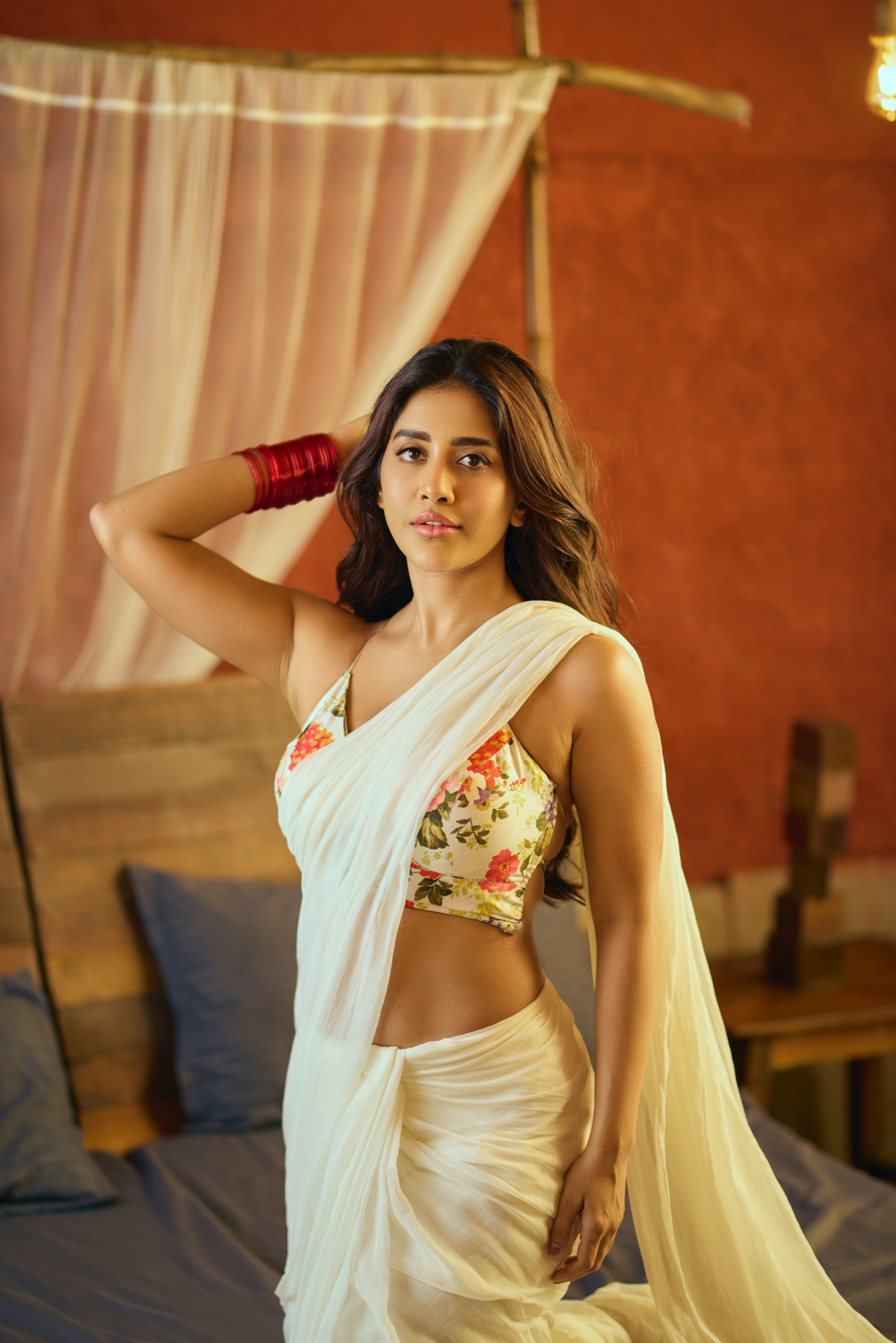 Nabha Natesh effortlessly blending tradition with a dash of modern flair–because who says you can't be both classy and a little sassy, all while looking like a million bucks in floral charm and flowing silk?