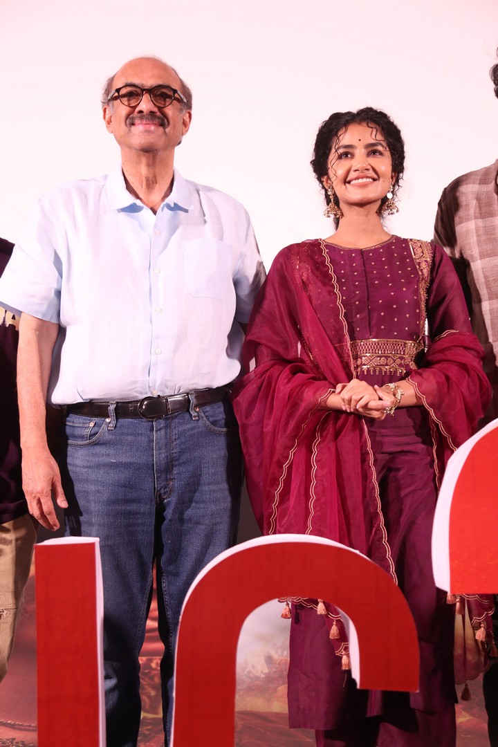 Producer Suresh Babu and actress Anupama Parameswaran posed together, sharing a light moment during the press interaction.