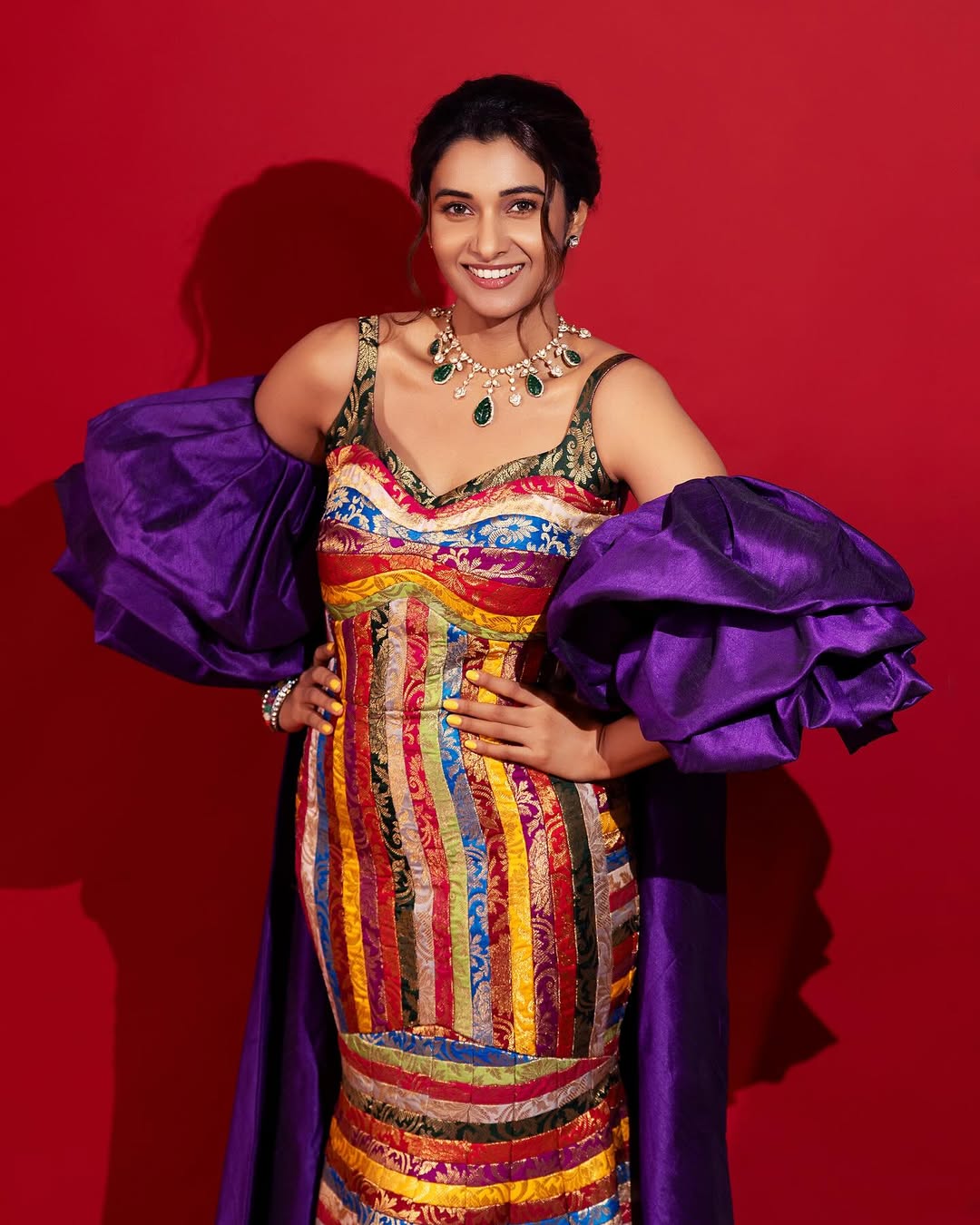 Priya Bhavani Shankar effortlessly blends traditional vibrance with contemporary flair, proving that bold colors and even bolder sleeves are the ultimate power move–fashion with a dash of fun!