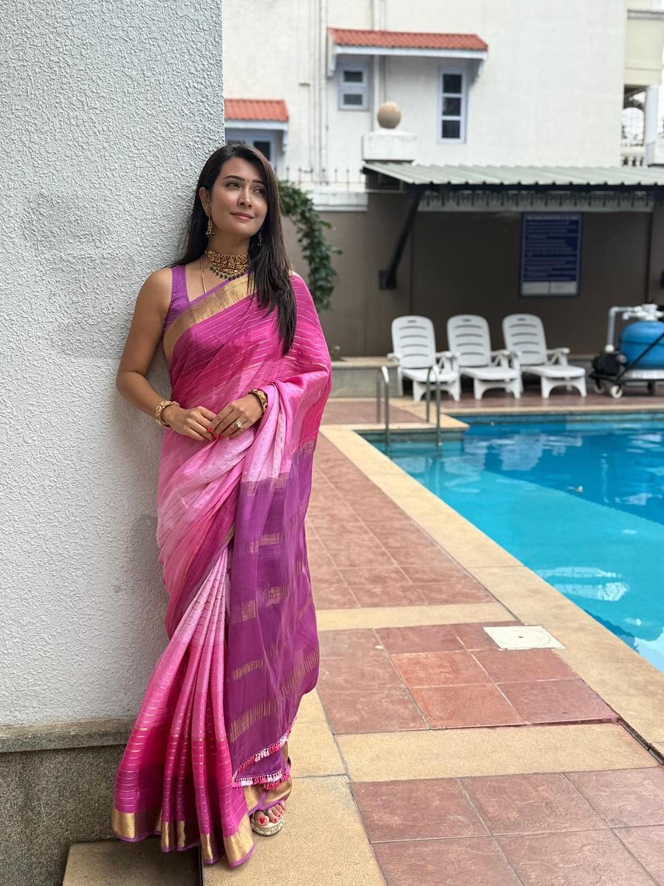 Radhika Pandit in a stunning pink saree, effortlessly blending tradition with style–proof that elegance and a touch of sparkle are always poolside essentials!