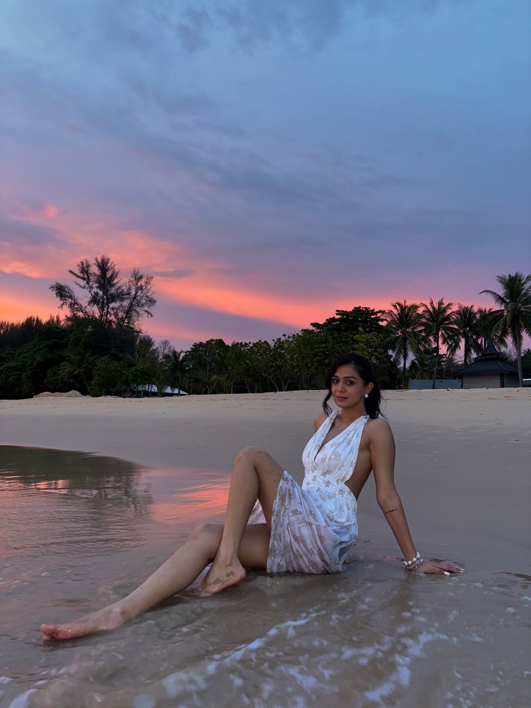 Rutvi Tiwari turning beach chic into a sunset masterpiece–white dress, water splashes, and a style so fresh even the sky is jealous!