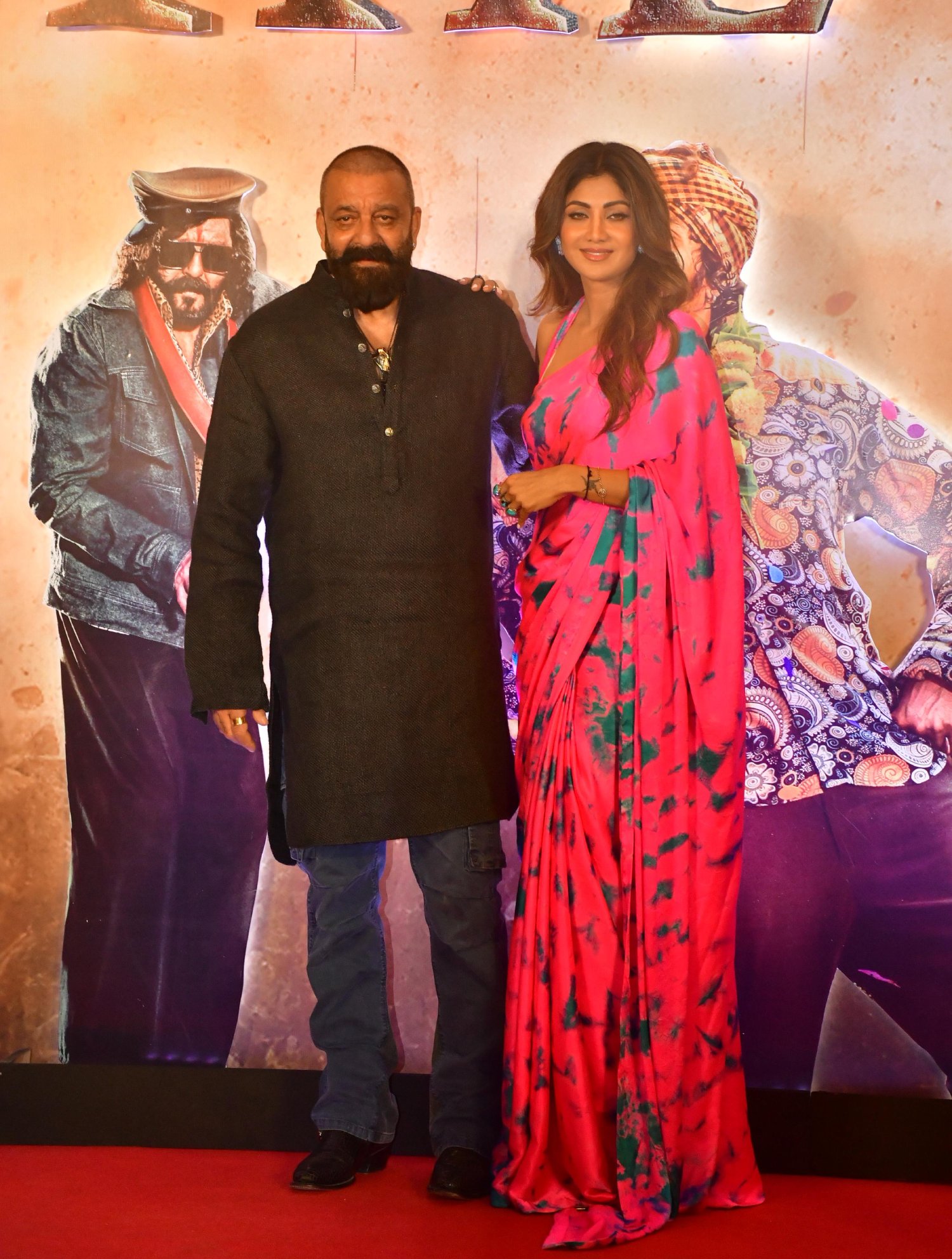 Sanjay Dutt and Shilpa Shetty share a charismatic frame, posing elegantly for the press.