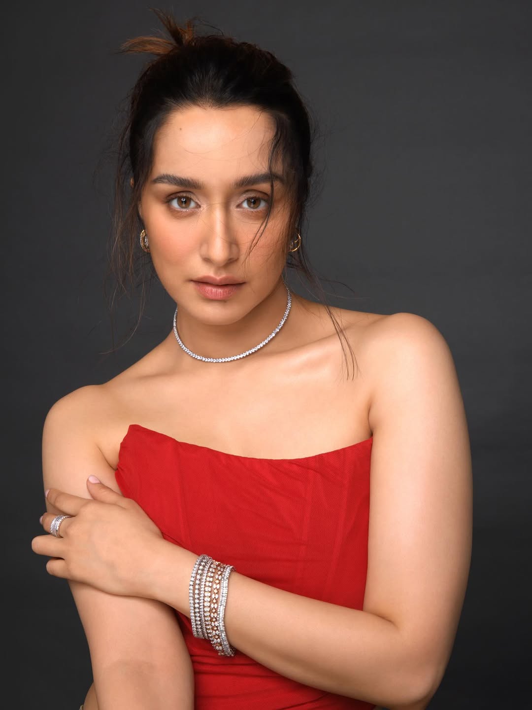 Shraddha Kapoor in a stunning red ensemble, proving that elegance and fierce style can go hand in hand–because who says you can't turn heads while keeping it classy and a little bit sassy?