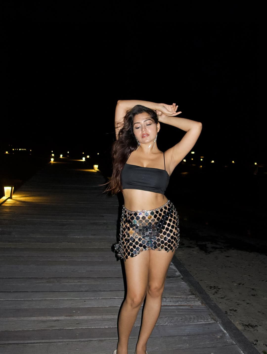 Simran Kaur channels midnight magic with a daring crop top and mirror mini–proof that her style shines brightest when the lights are out!
