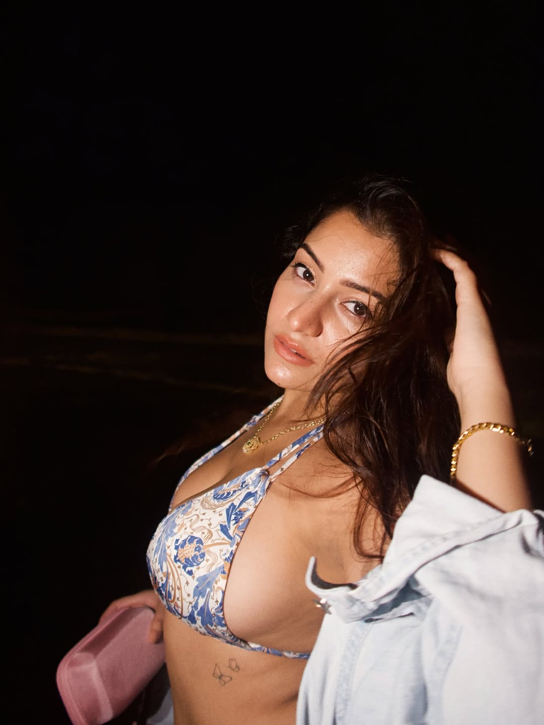 Simran Kaur owns the night–showcasing beachside glamour with a daring bikini, effortless style, and a smile that outshines even the darkest skies!