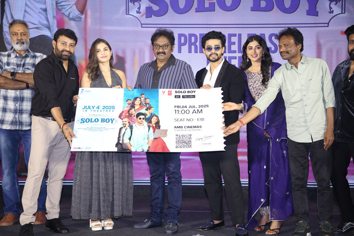 The cast and crew come together to ceremoniously unveil the movie ticket