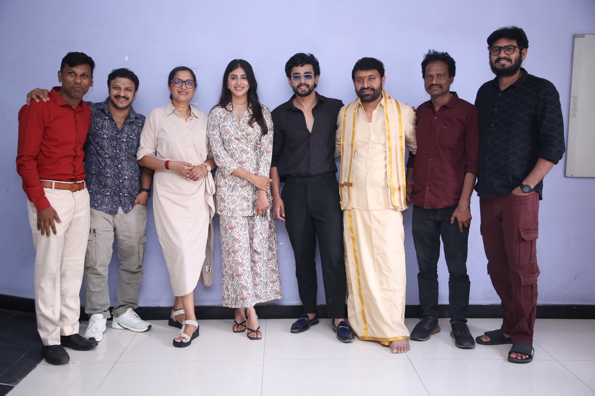 The cast and crew of Solo Boy strike a pose for the media, radiating joy and camaraderie.