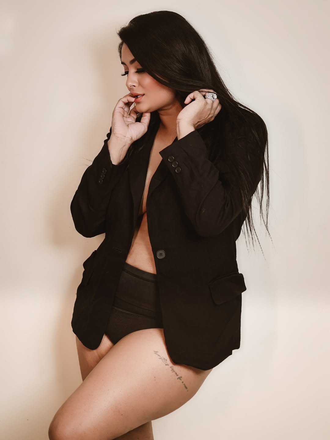 Effortlessly blending power and playfulness–leading the style game with a confident smile, a chic blazer, and just the right touch of mischief!