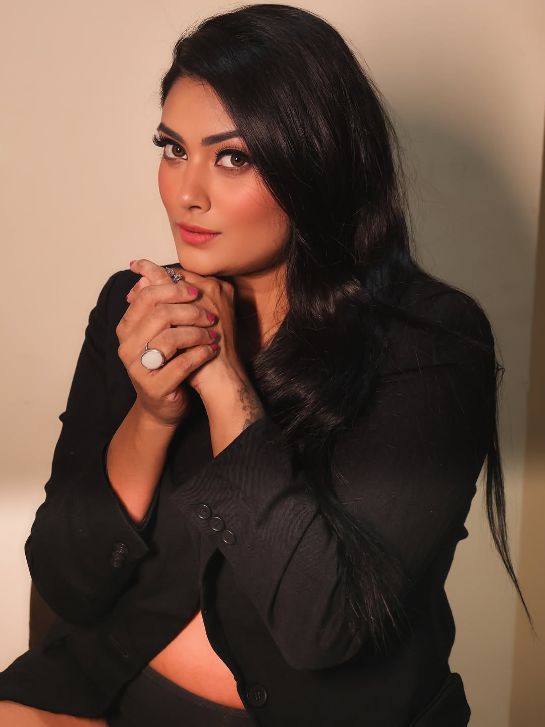 Slaying the corporate chic game with a dash of daring–power blazer, confident gaze, and just enough edge to keep them on their toes!