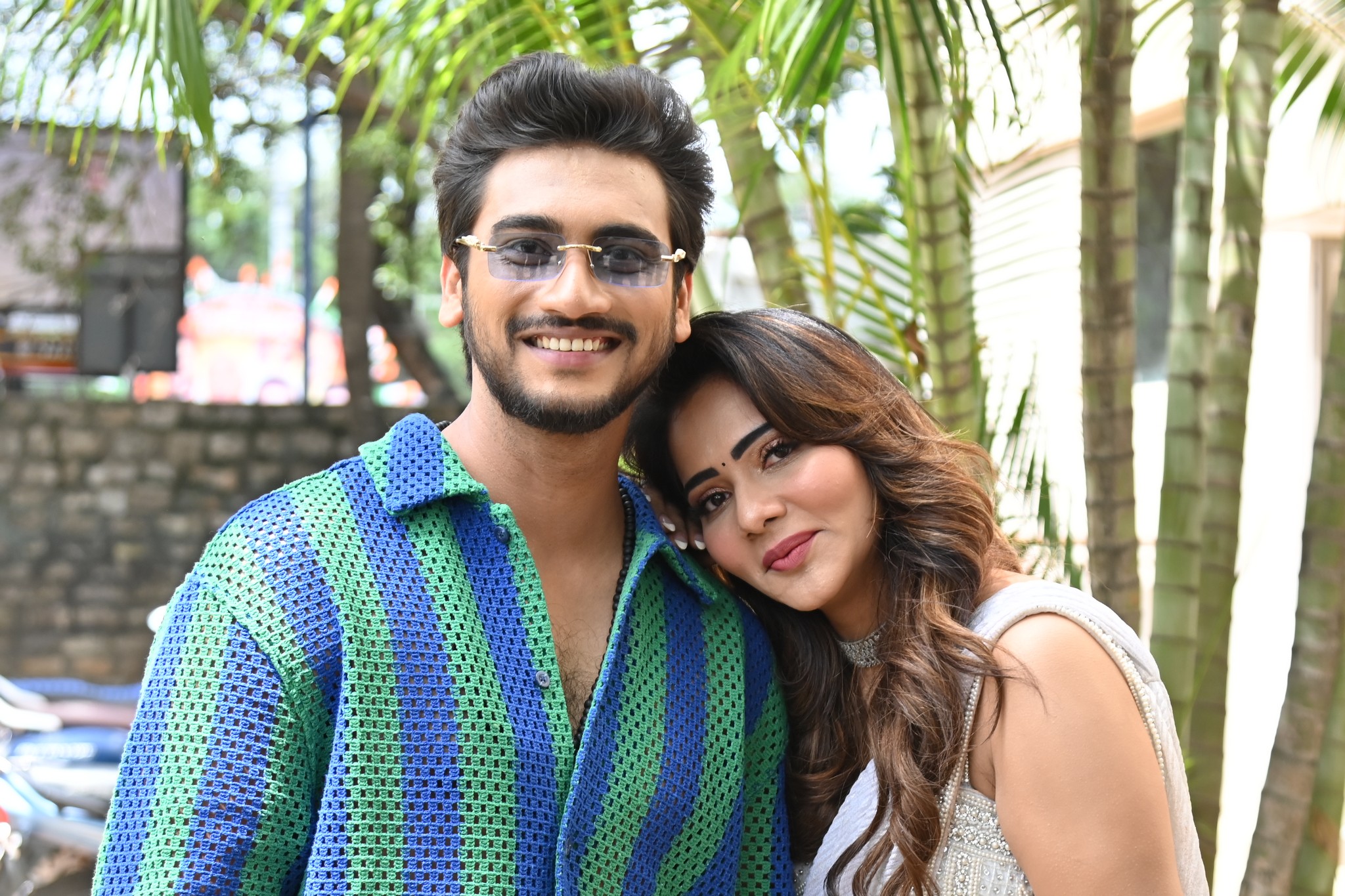 Geethanandh and Mitraaw Sharma share a warm moment, showcasing their camaraderie during the media photoshoot