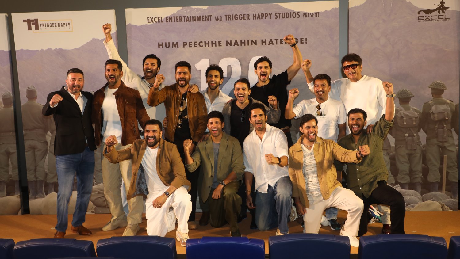 The cast and crew assemble on stage, raising slogans in unison to mark the powerful launch of 120 Bahadur.