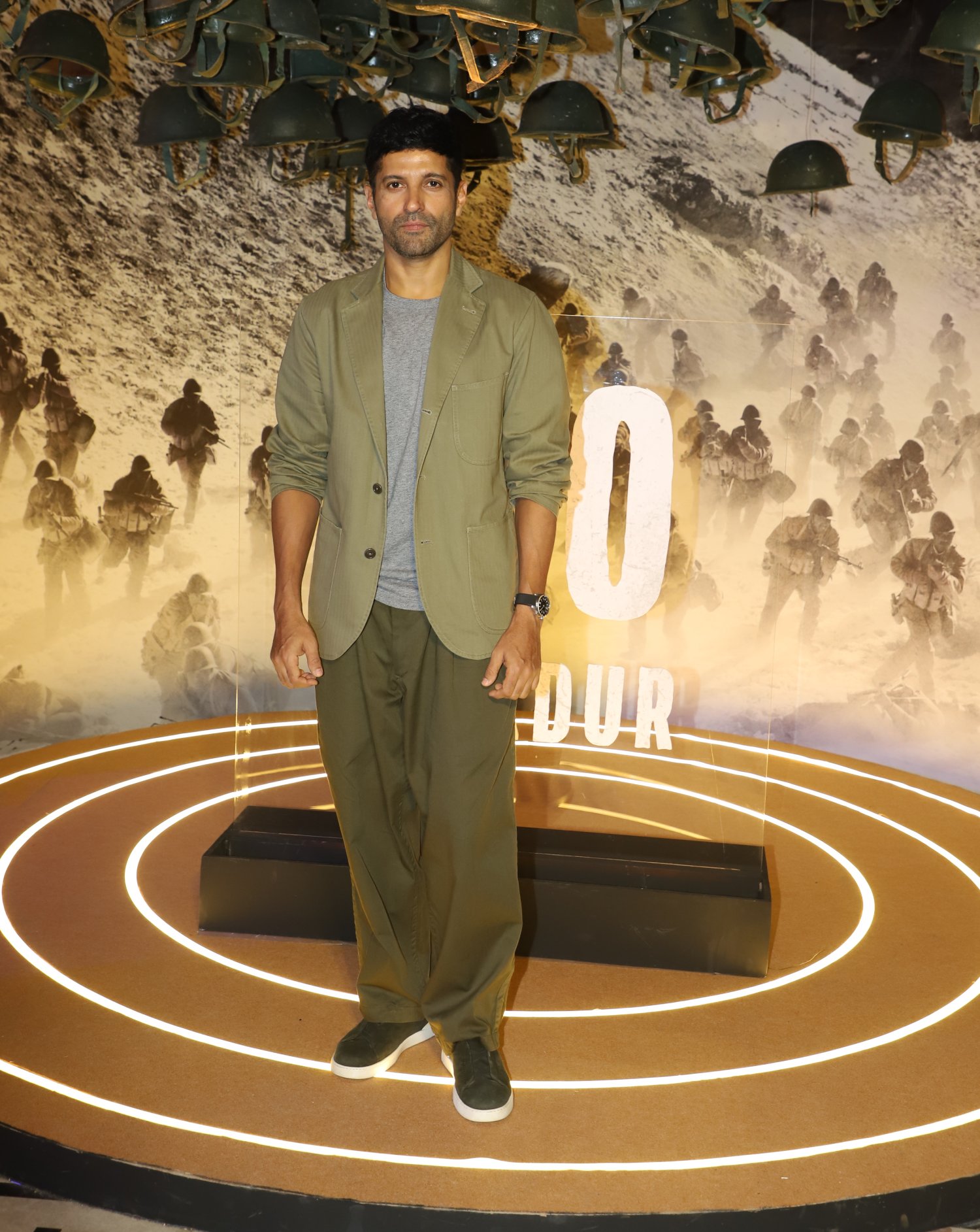 Farhan Akhtar strikes a confident pose at the media photoshoot, drawing all eyes with his charismatic presence.