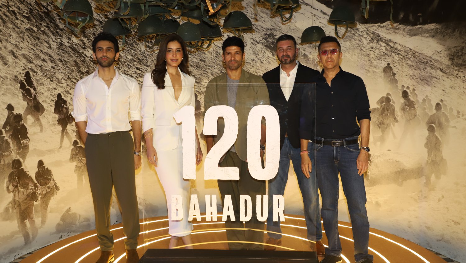 Sparsh Walia, Raashii Khanna, Farhan Akhtar, Razneesh Ghai, and Ritesh Sidhwani pose for a dynamic group shot, celebrating the spirit of 120 Bahadur.