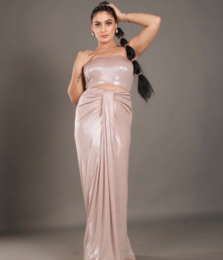 Payas Pandit effortlessly combines glamour and grace, proving that a satin drape and a confident pose are the perfect accessories for making a stylish statement.