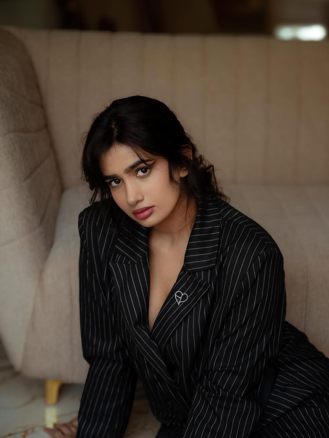 Anjali Anish in pinstripe outfit with elegance