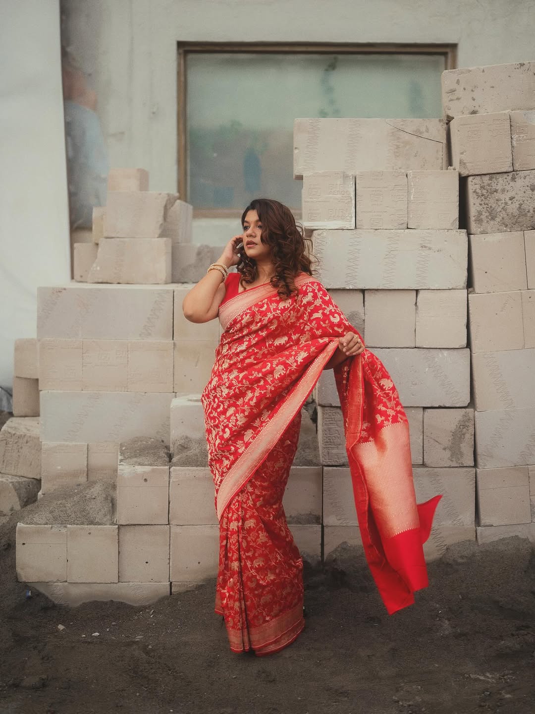 Aparna Balamurali rocks the traditional saree with a confident pose–proof that timeless elegance can also have a playful edge, even amidst construction zones.