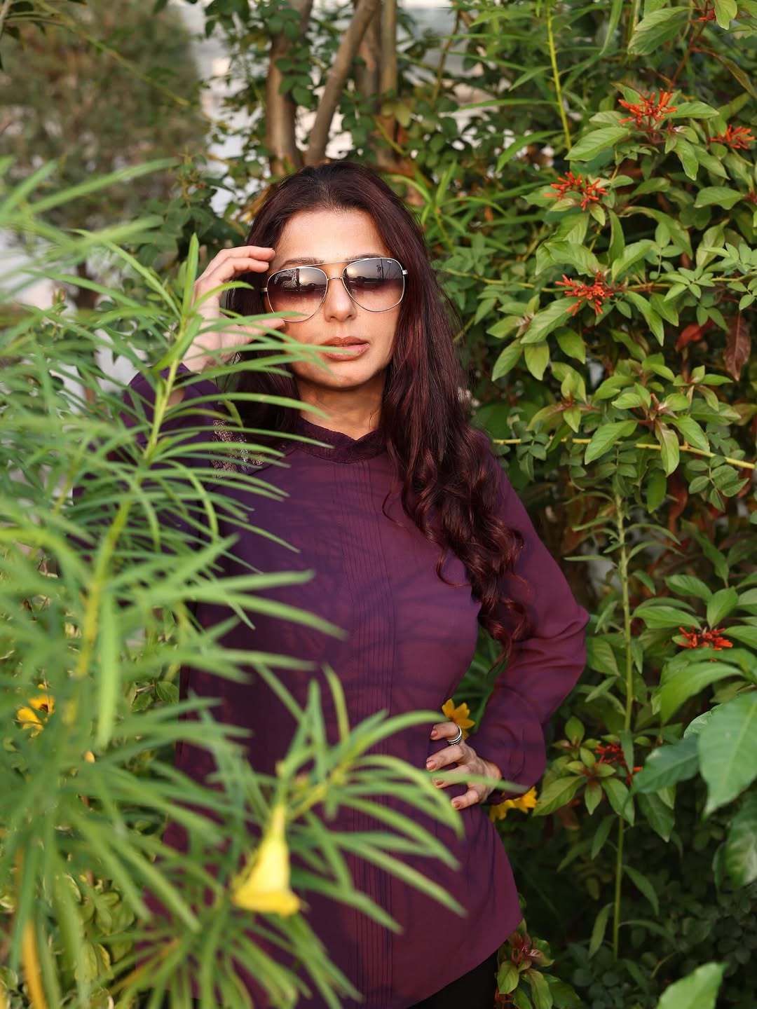 Bhumika Chawla channels botanical brilliance in a rich plum ensemble–proving that even amidst greenery, her style blooms with a touch of playful elegance and a dash of humor!