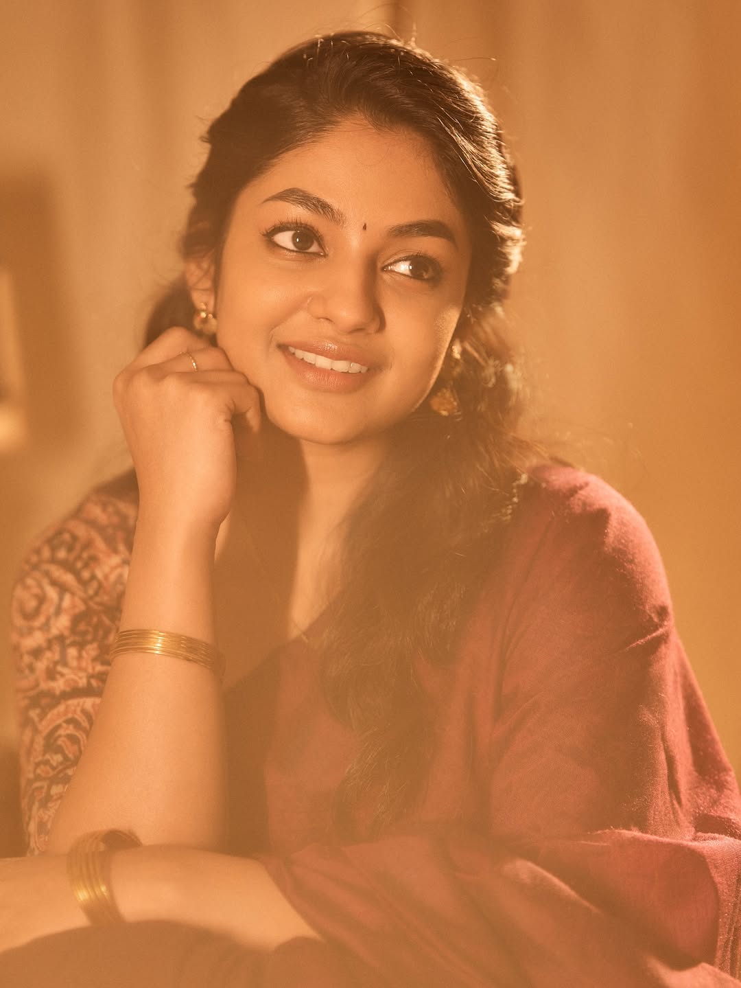 Ivana glowing in rich earthy-toned ensemble