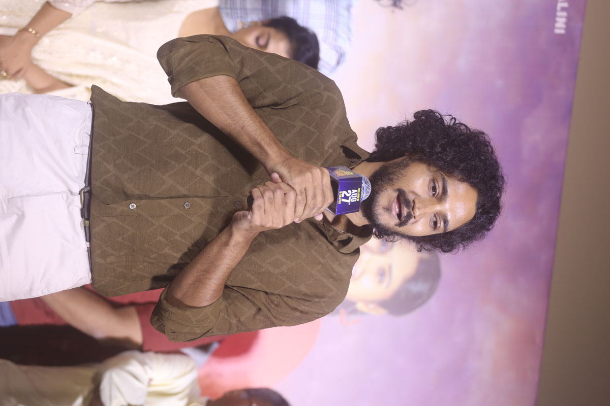 Sree Charan addressing audience during his speech