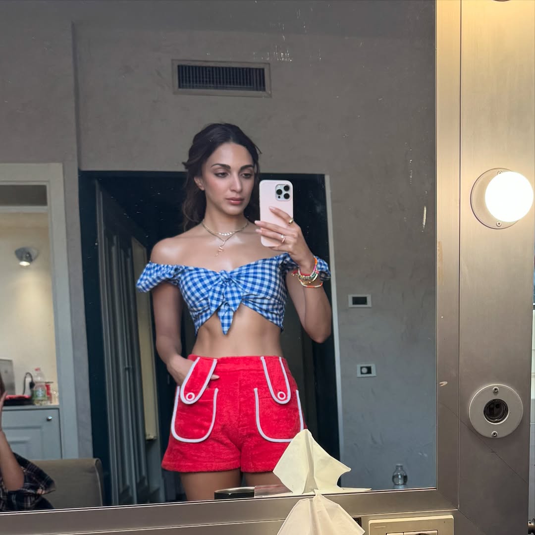 Kiara Advani is serving summer vibes and sassy style in a playful gingham crop top and vibrant red shorts—proof that fashion can be both fun and fabulous!