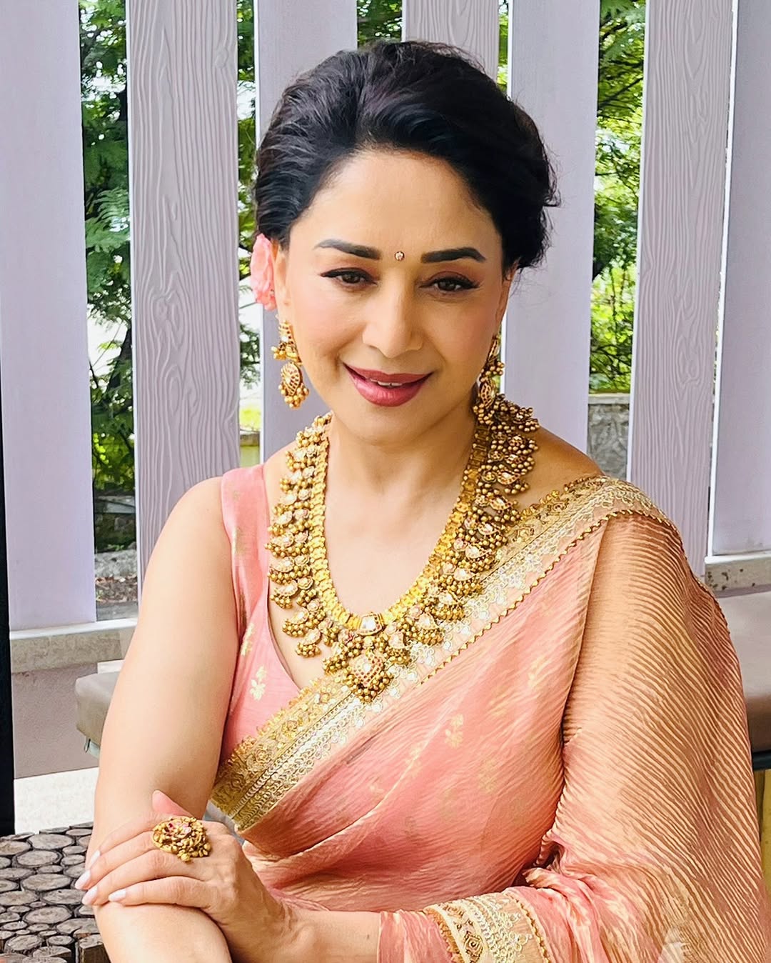 Madhuri Dixit dazzles in gold silk saree.