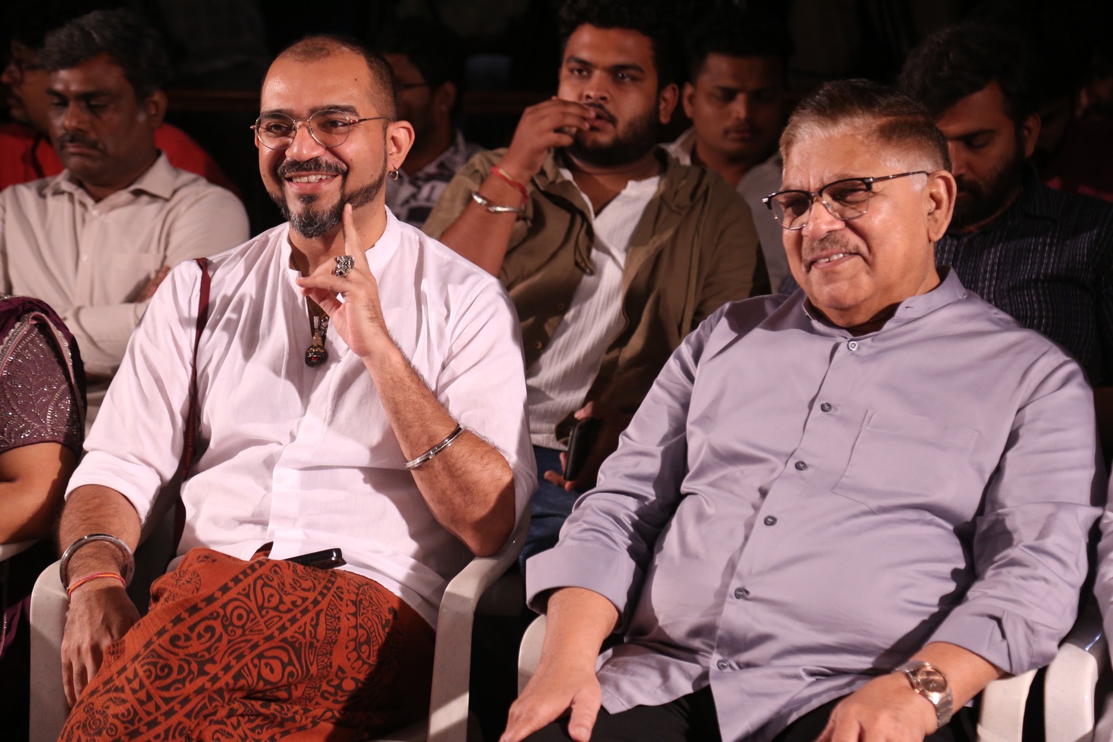 Director Ashwin Kumar and Producer Allu Aravind share a moment while seated at the gathering.