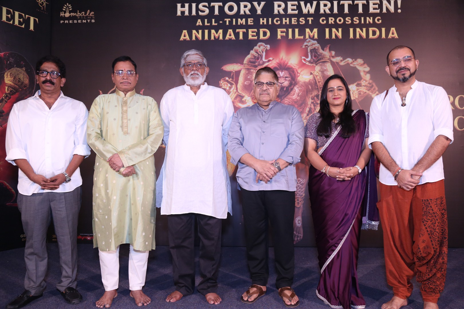 Lyricist Jonnavuthula delivers his speech as Tanikella Bharani, Allu Aravind, Shilpaa Dhawan, and Ashwin Kumar join for a group photo session.
