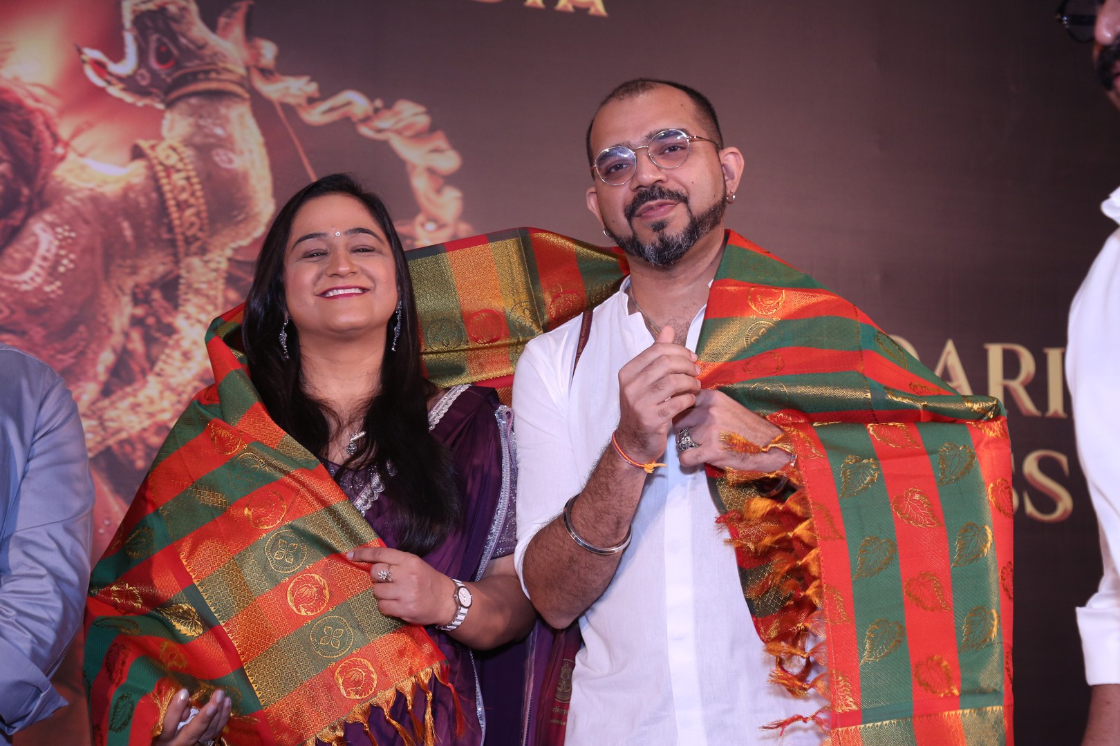 The team extends a traditional shawl welcome to Shilpaa Dhawan and Ashwin Kumar, marking a warm gesture of appreciation.