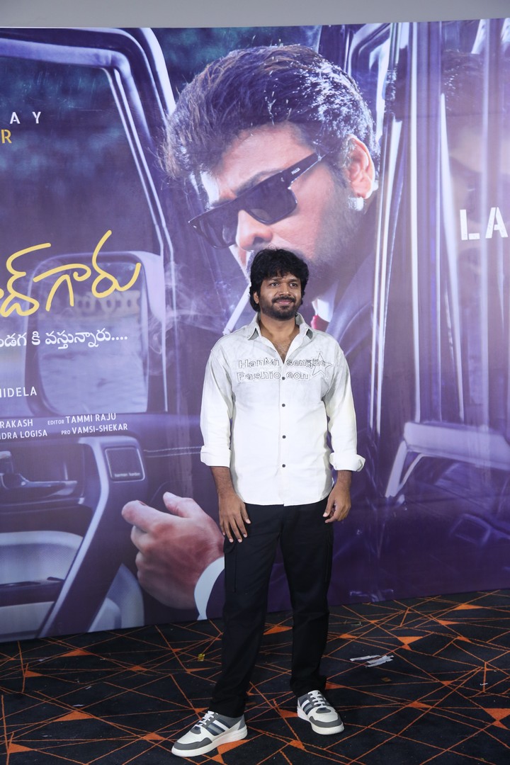 Anil Ravipudi posing for media photos
