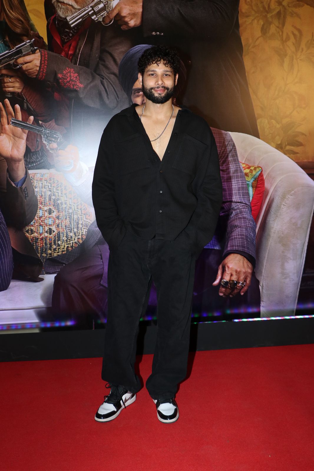 Siddhant Chaturvedi captivates with his charismatic solo pose for the cameras.