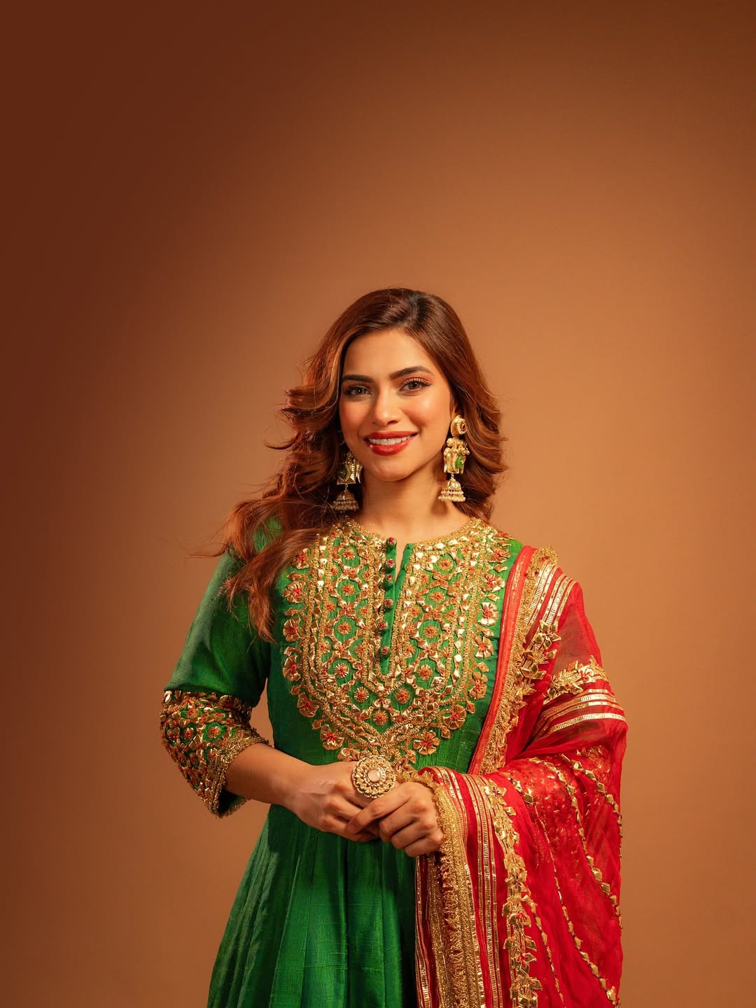 Nagma Mirajkar in regal green red ensemble