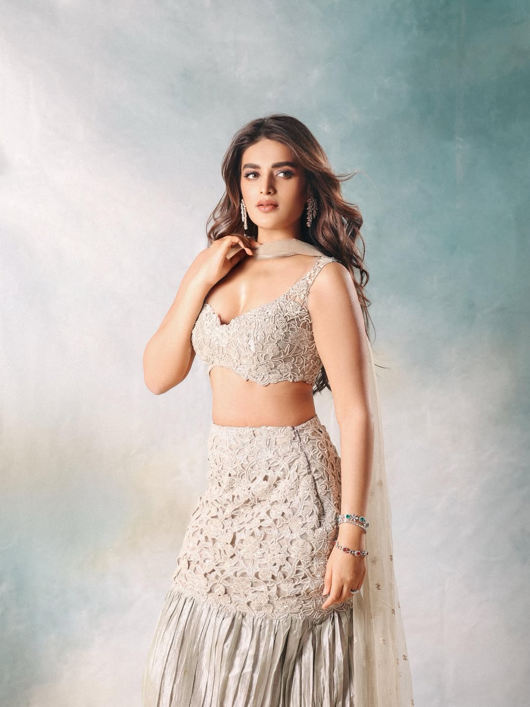 Nidhhi Agerwal exudes elegance in an intricate beige ensemble that proves simplicity and sophistication can coexist–making her the perfect blend of grace and glamour with a touch of playful charm!