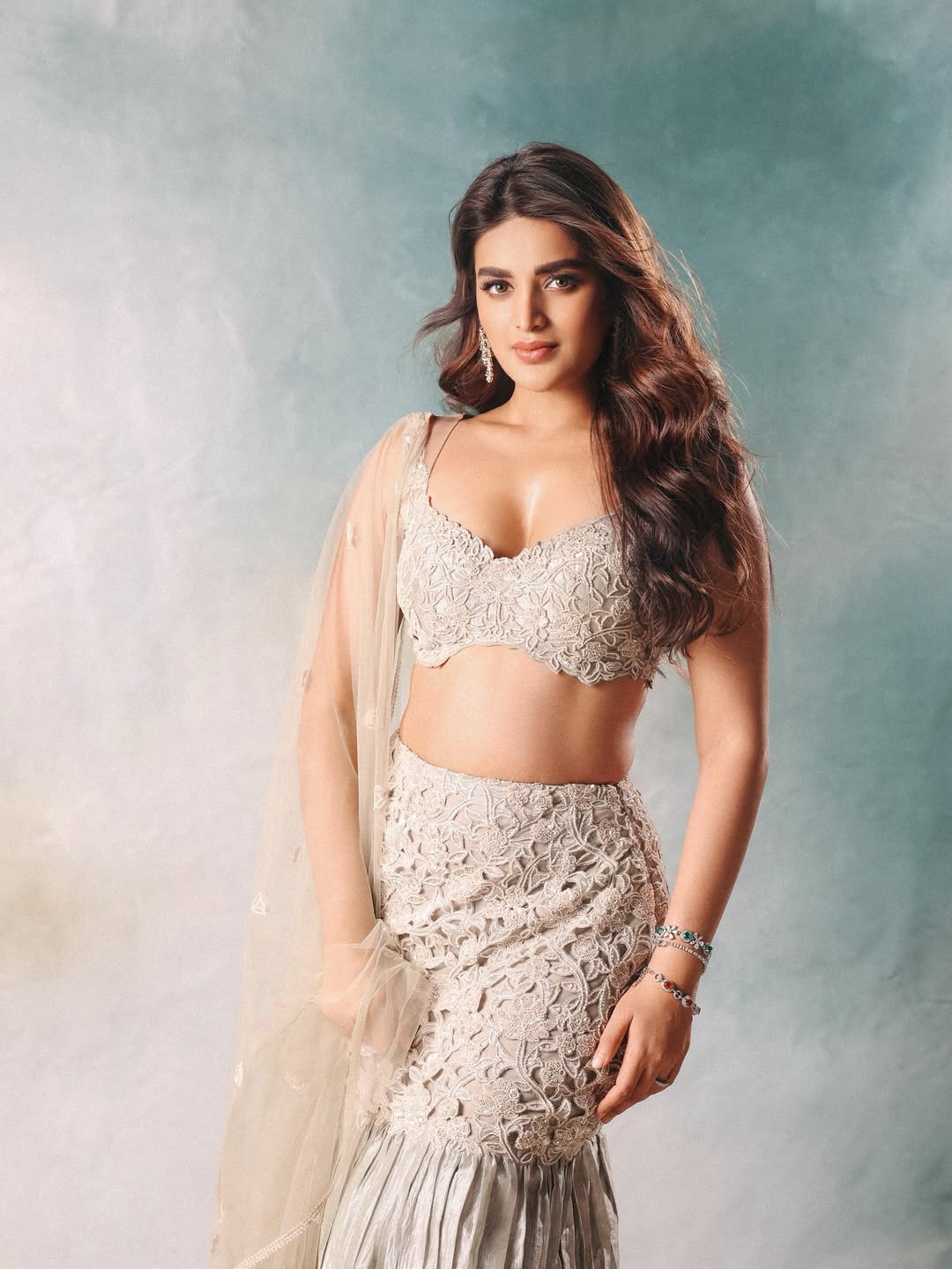 Nidhhi Agerwal effortlessly blends elegance and allure in a stunning lace ensemble that’s both chic and cheeky–proof that style can be sophisticated with a dash of fun!
