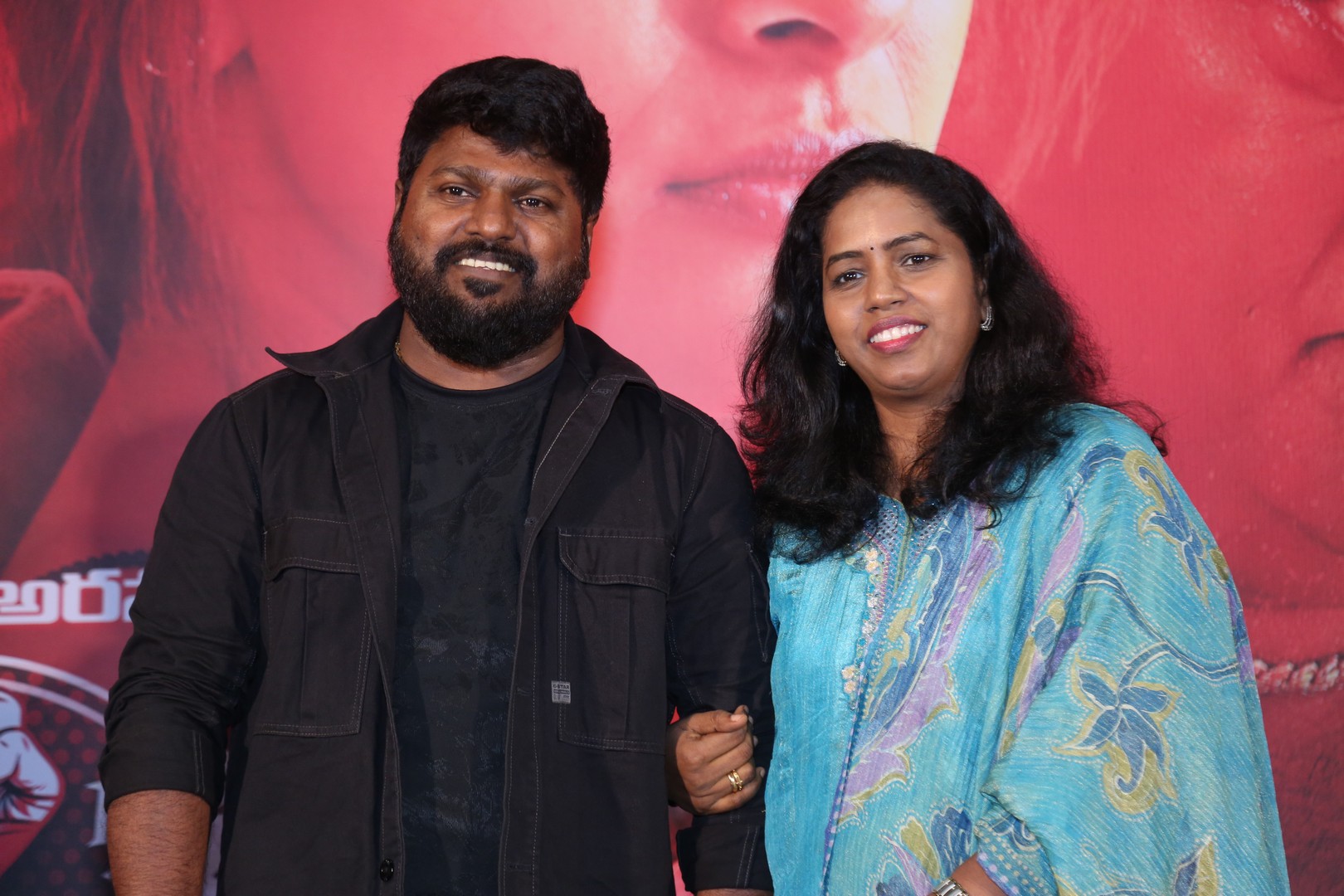 Director Anal Arasu and Producer Rajalakshmy strike a pose for the media photoshoot.