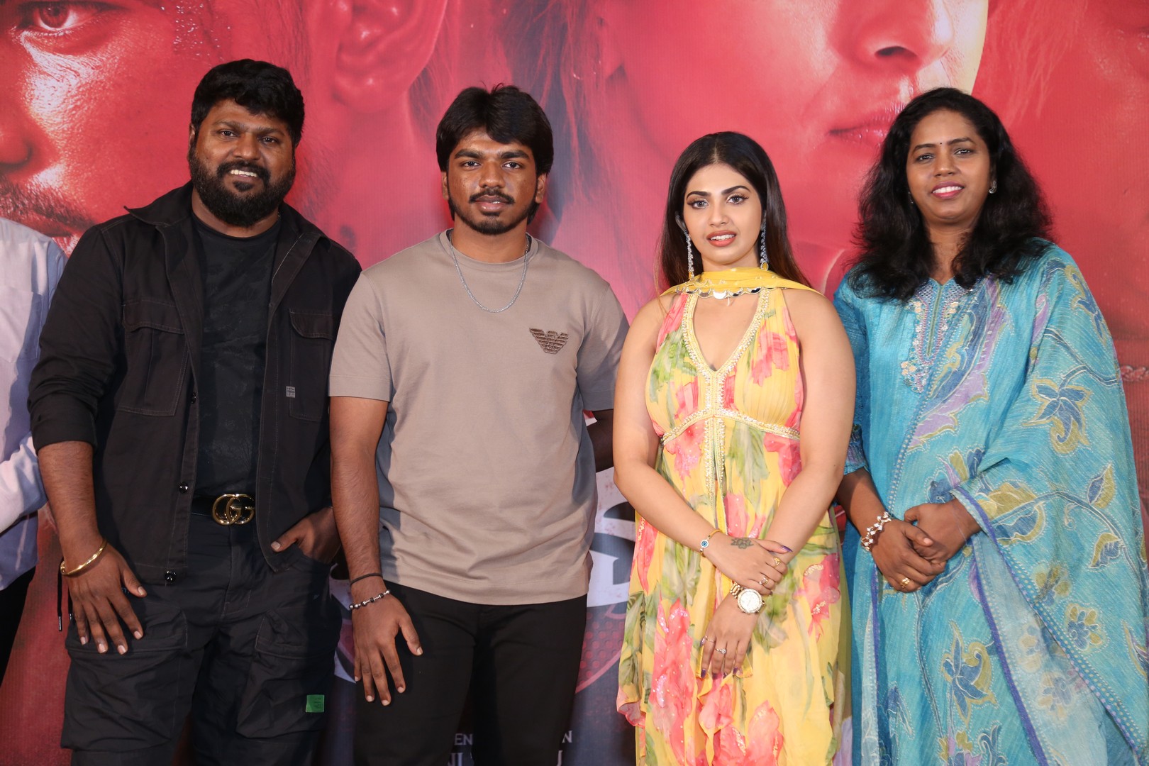 Director Anal Arasu, Actor Surya Sethupathi, Actress Varsha, and Producer Rajalakshmy captured in a media photoshoot moment.