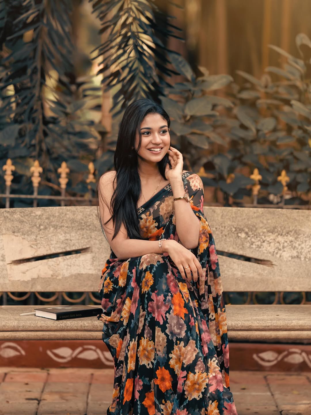 Priyanka Achar radiates effortless elegance in a vibrant floral saree, proving that timeless style and a touch of humor are always in fashion.