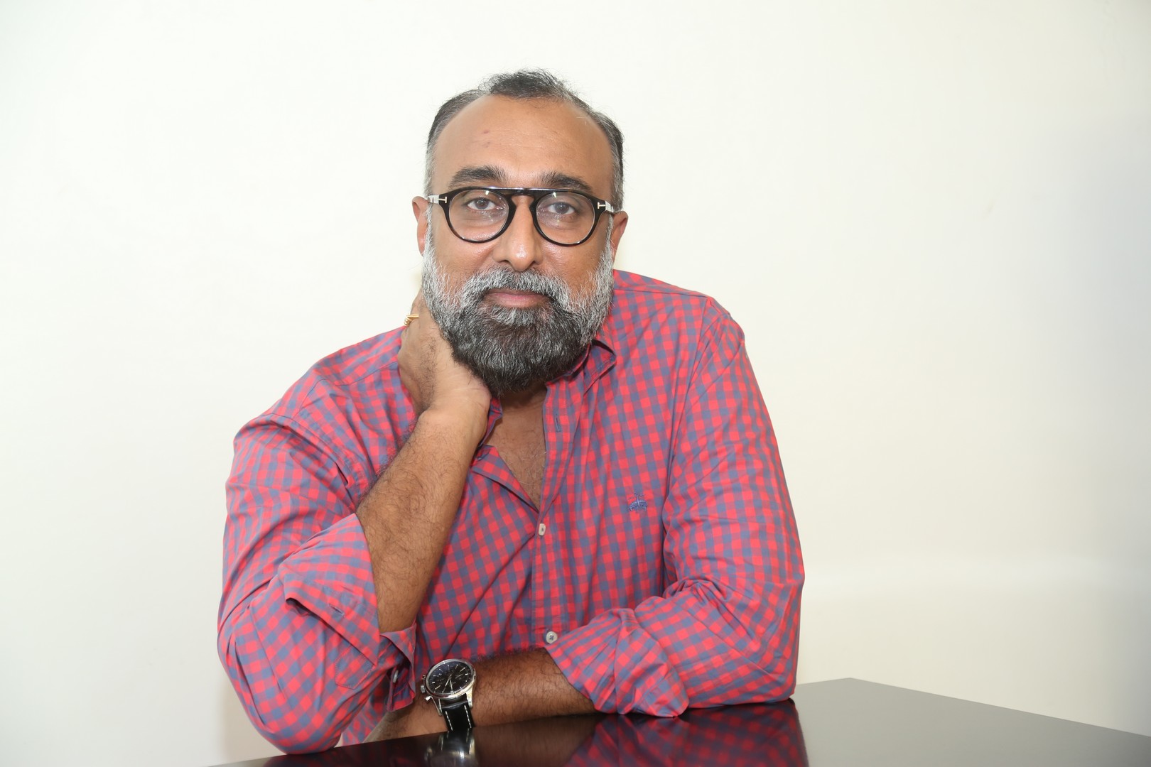 Rajeev Reddy Yeduguru professional style with checkered shirt