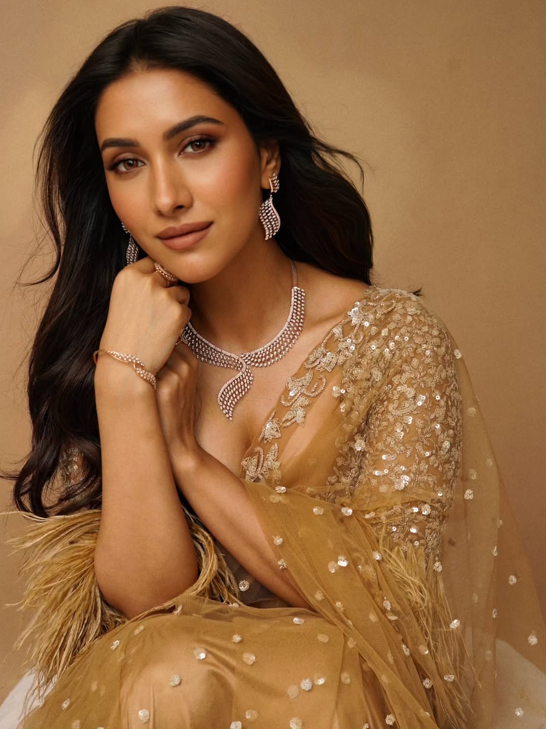 Rukmini Maitra shines with elegance and golden sparkle