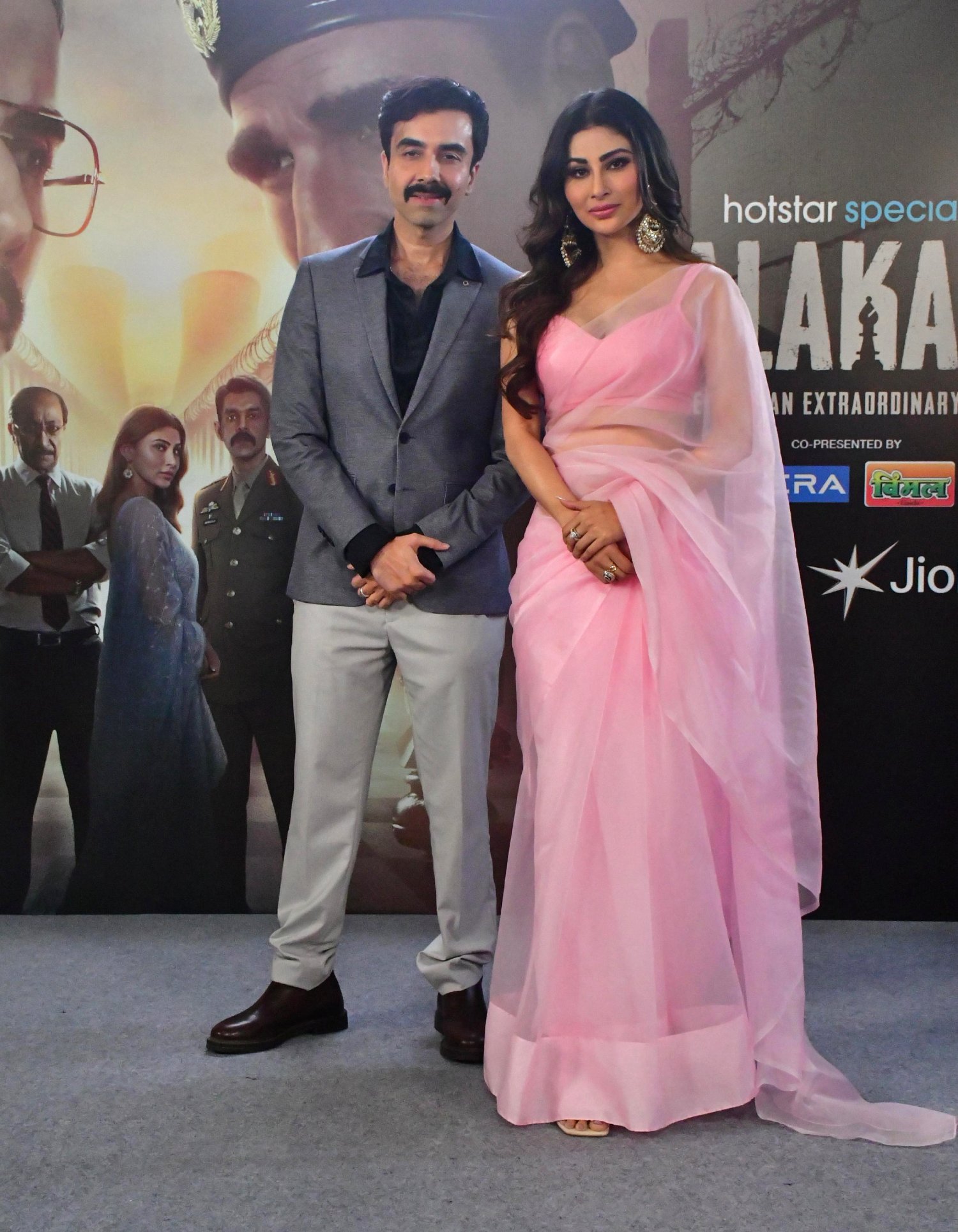 Naveen Kasturia and Mouni Roy strike a stylish pose for the cameras during the promotional event.