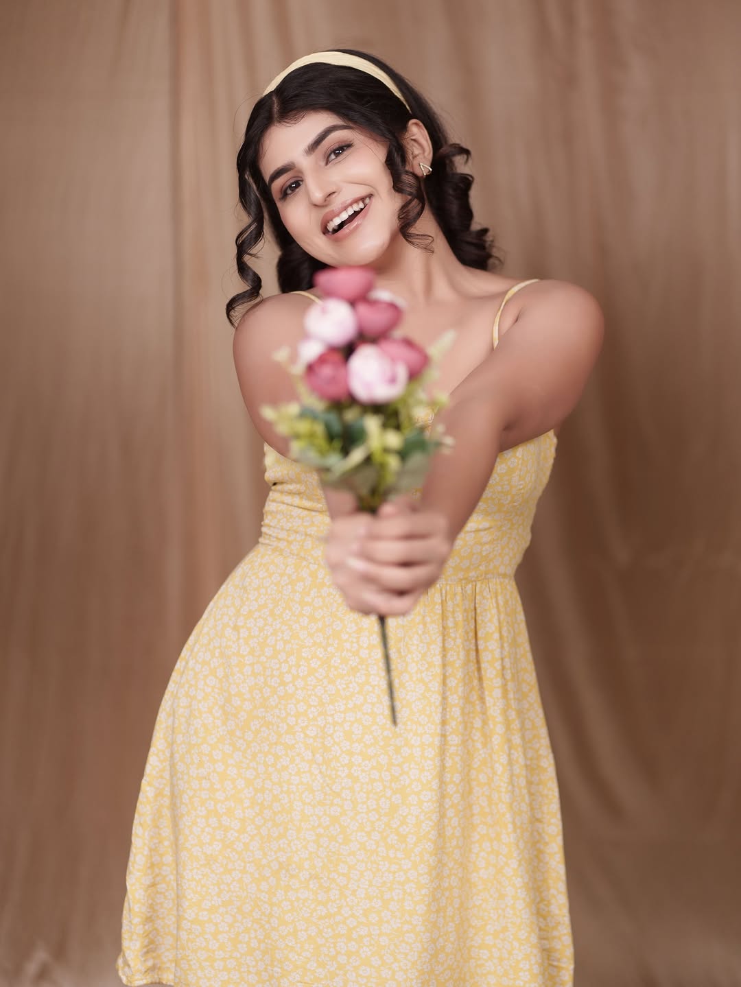 Sharanya Shetty effortlessly blends sunshine and elegance in a charming yellow dress, proving that floral style is always in bloom–even when you're just holding a bouquet!