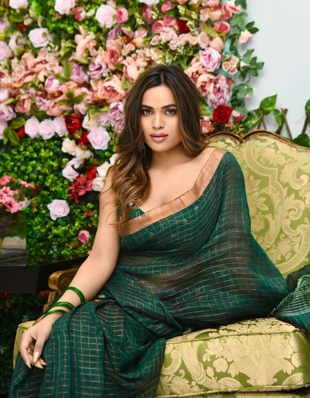 Shivani Sharma elegant saree with floral backdrop grace