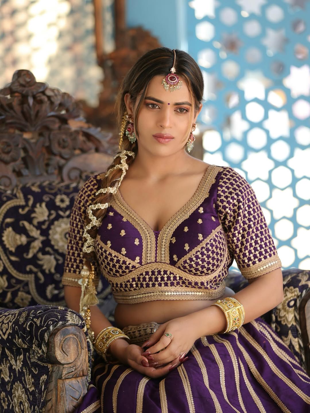 Shivani Sharma regal purple attire with intricate jewelry