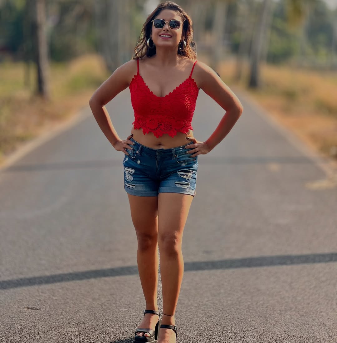 Sneha Paul in red crop top and denim shorts