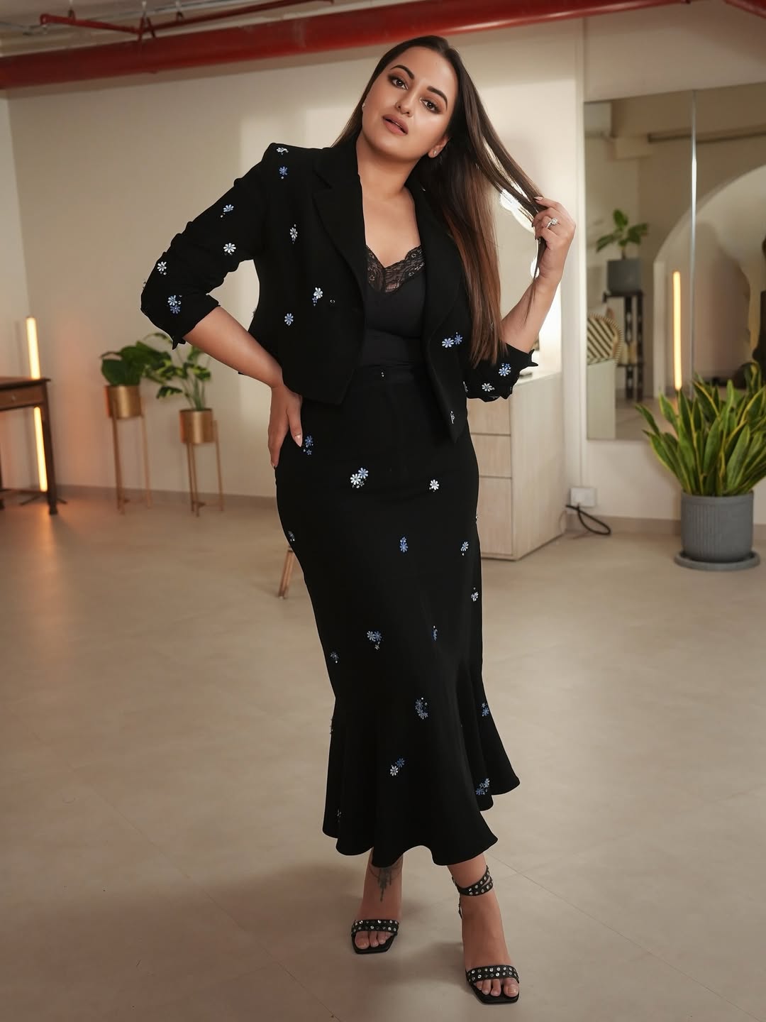 Sonakshi Sinha proves that classic black with a touch of floral charm is always in vogue–effortlessly stylish and ready to turn heads, even with a dash of humor!