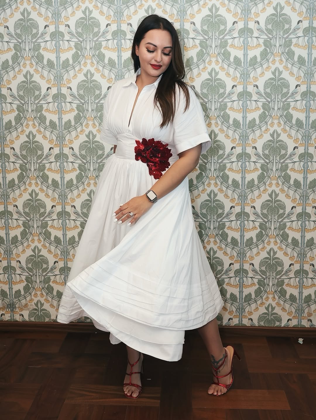 Sonakshi Sinha effortlessly combines classic elegance with a touch of boldness, proving that a white dress with floral flair is always in style – and she’s definitely stepping up her fashion game!