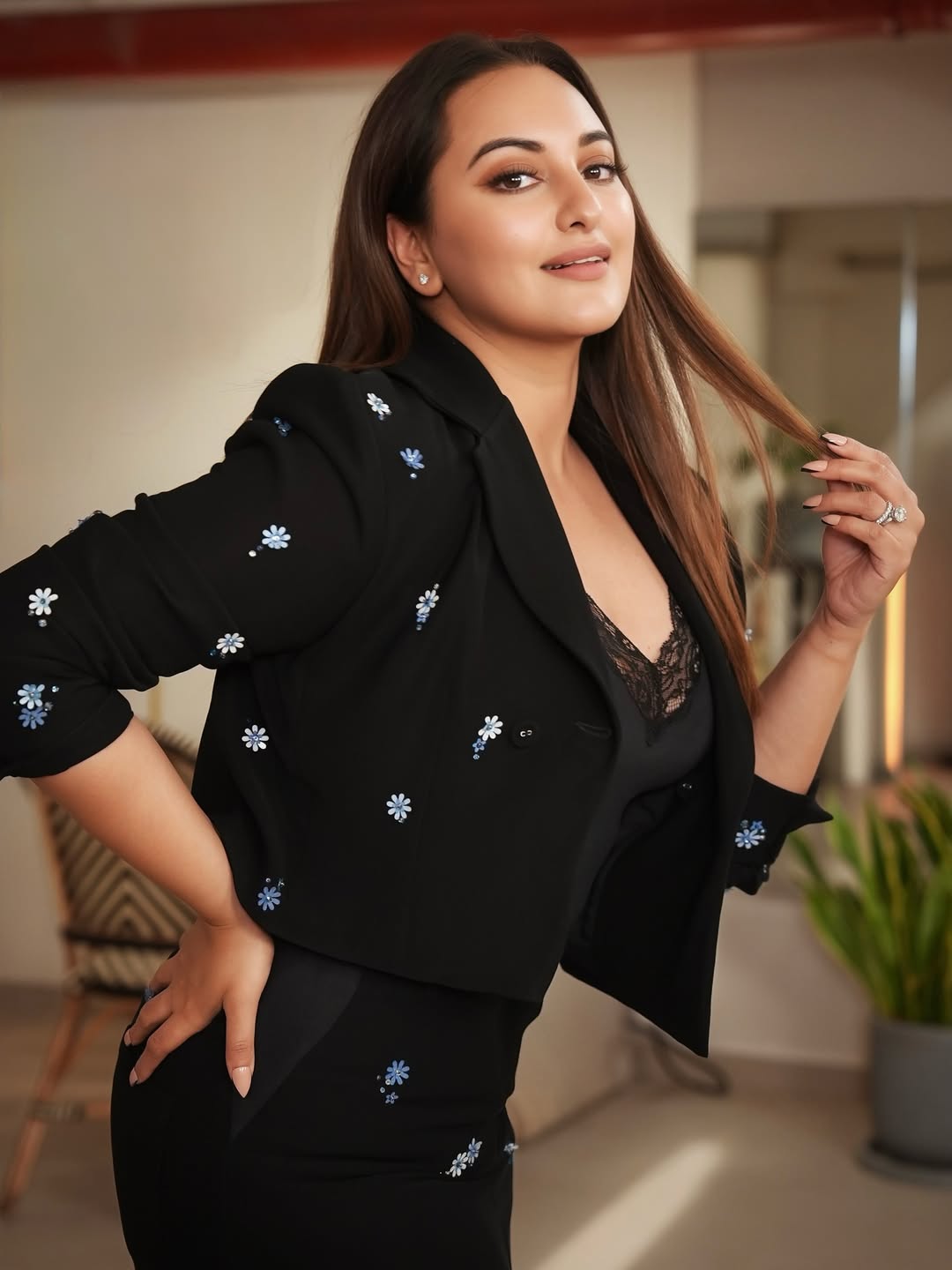 Sonakshi Sinha exudes effortless sophistication with a chic black ensemble adorned with delicate floral details–proof that understated elegance never goes out of style, even with a playful twist!