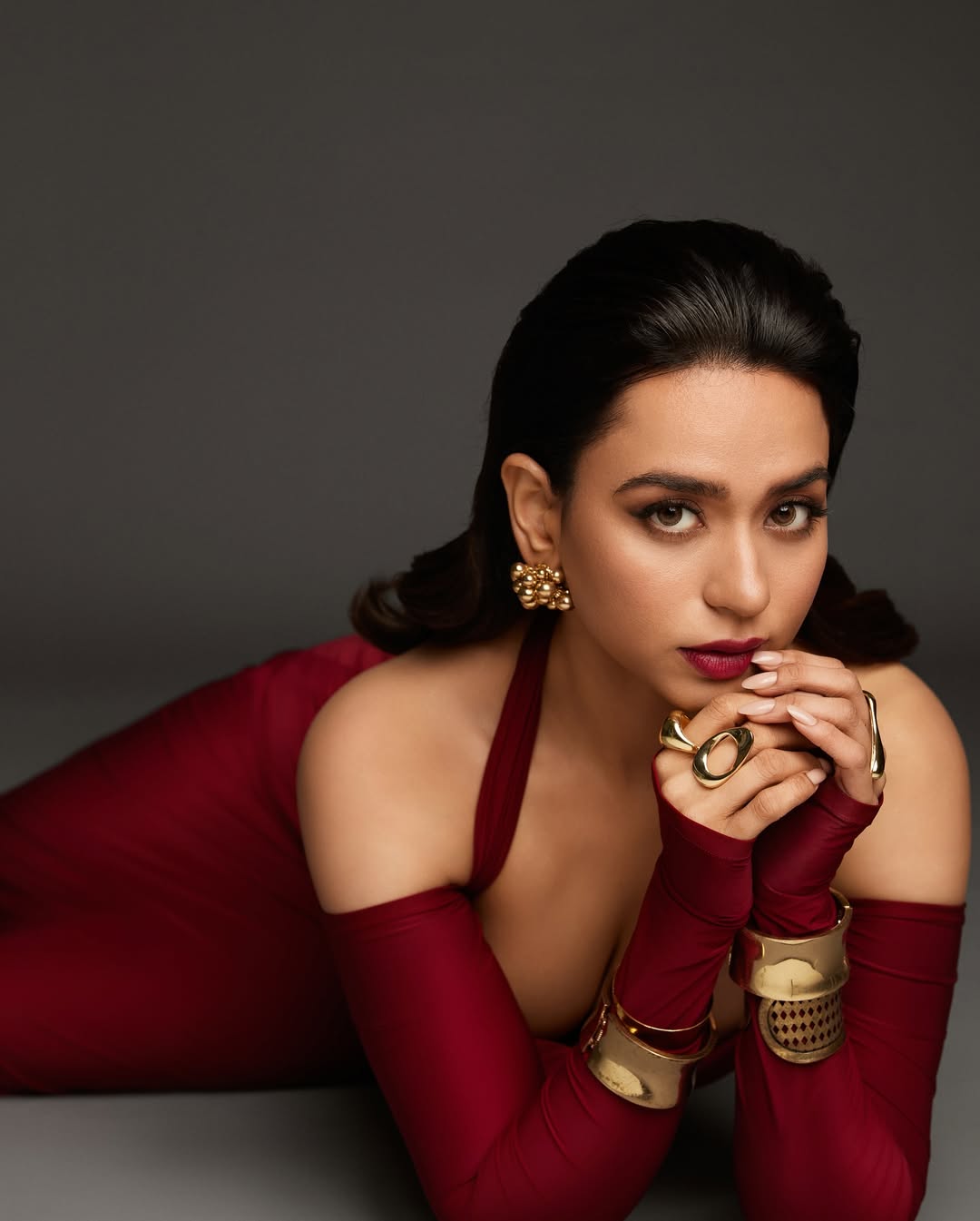 Soundarya Sharma redefines elegance with bold gold accessories and a striking crimson look–proof that style and sass are always in fashion.