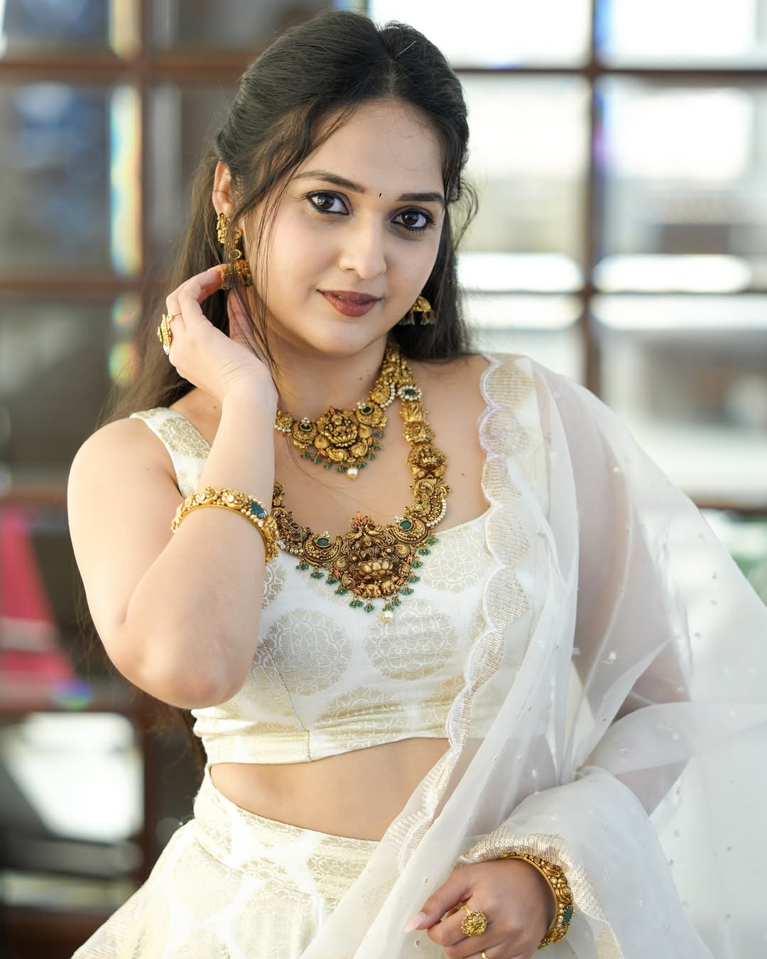 Spandana Somanna glowing in golden jewelry style